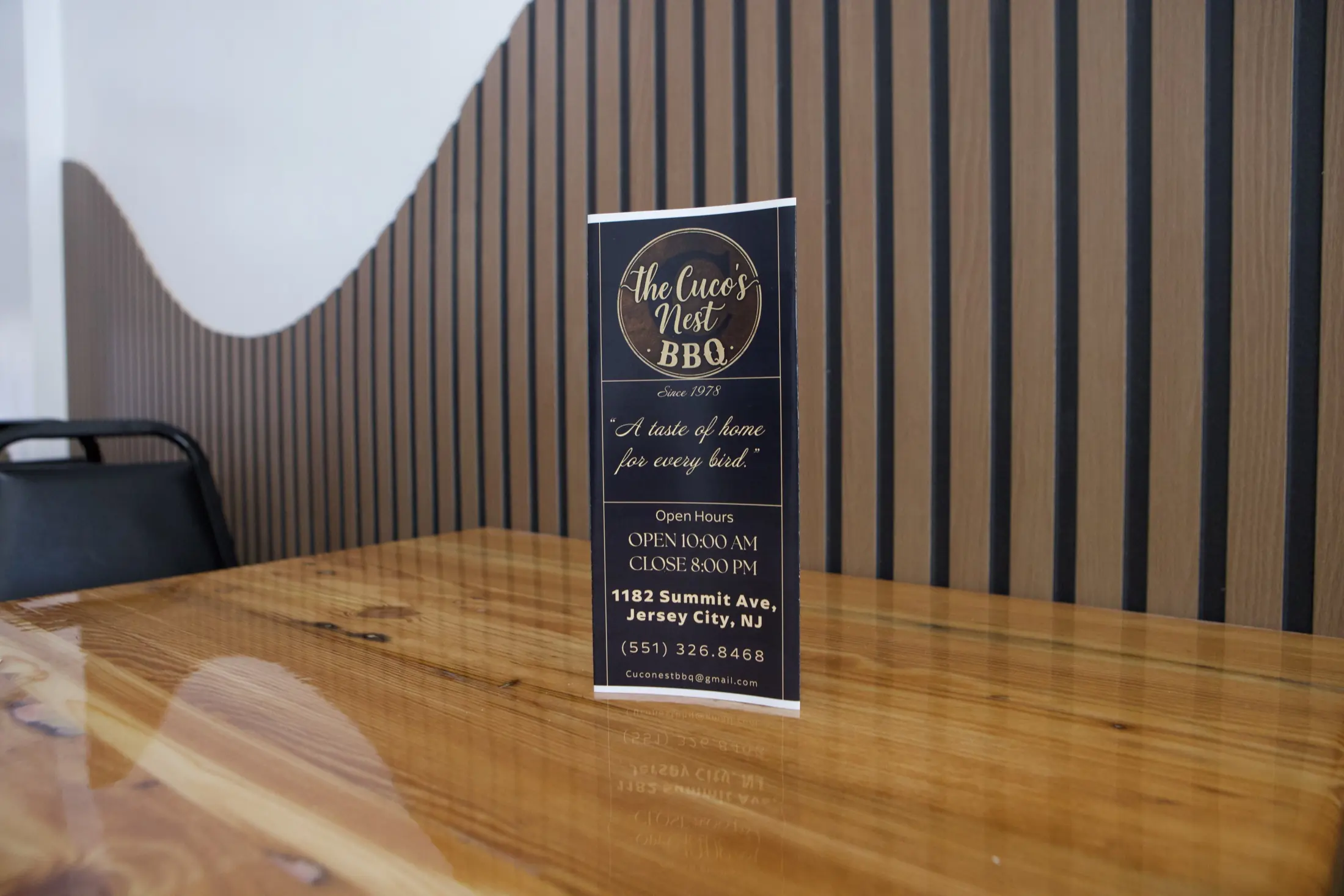 Restaurant tabletop information card against the wood wall